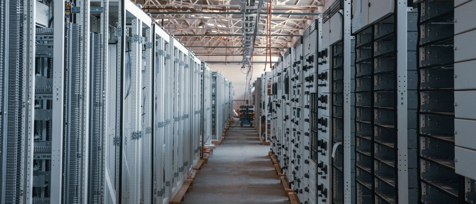 Long aisle between equipment racks in a server room