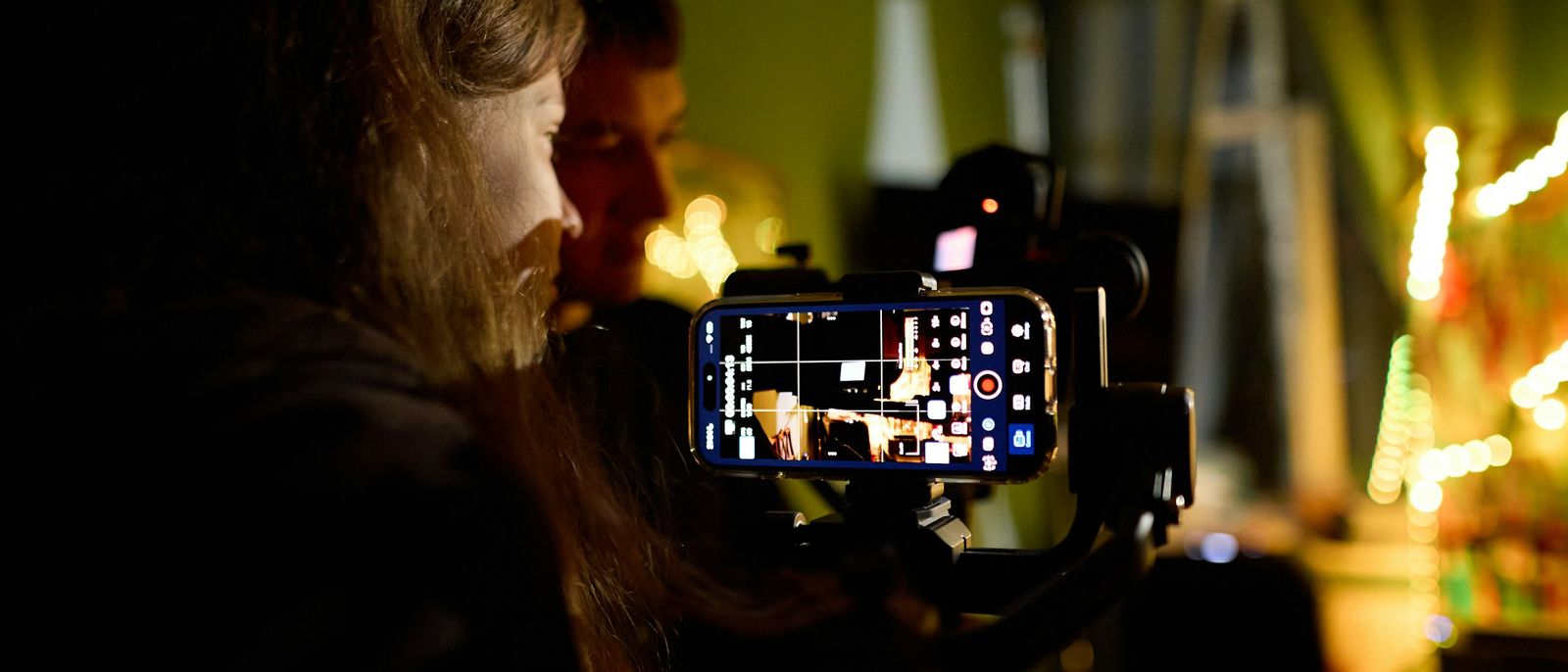 Two people filming with a smartphone on a gimbal