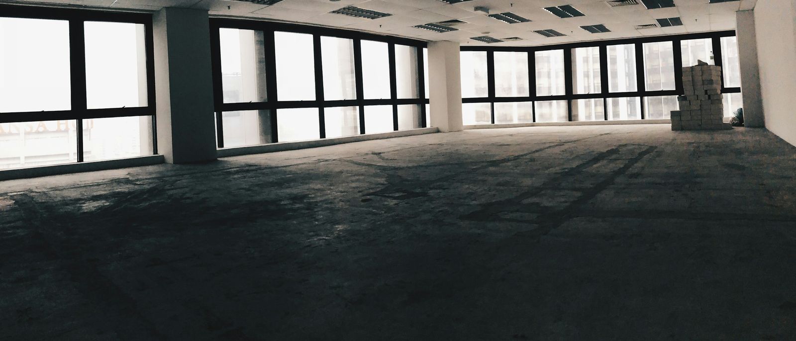 Empty open-plan office floor with daylight through the windows