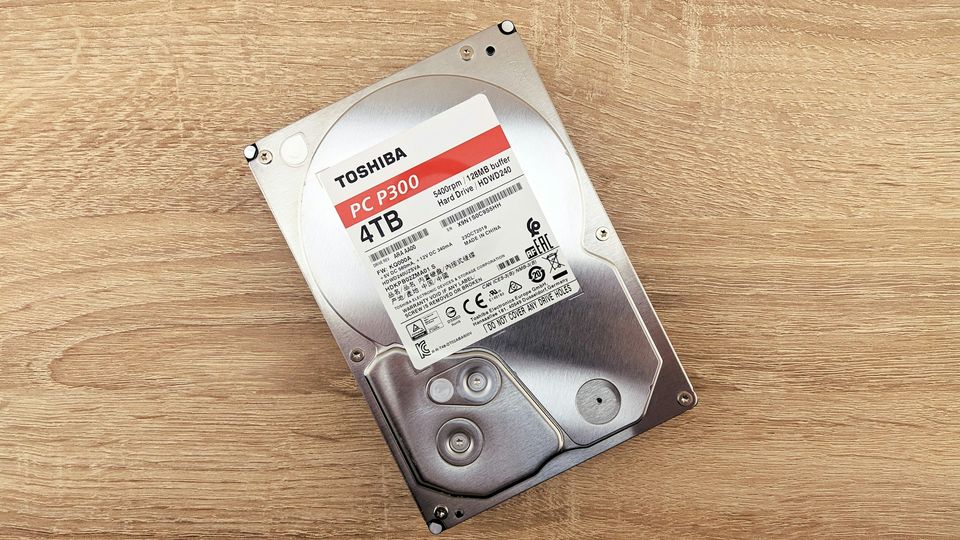 Hard drive lying on a wooden desk