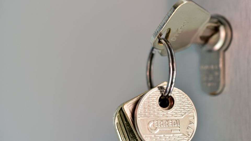 Bunch of keys left in a door lock
