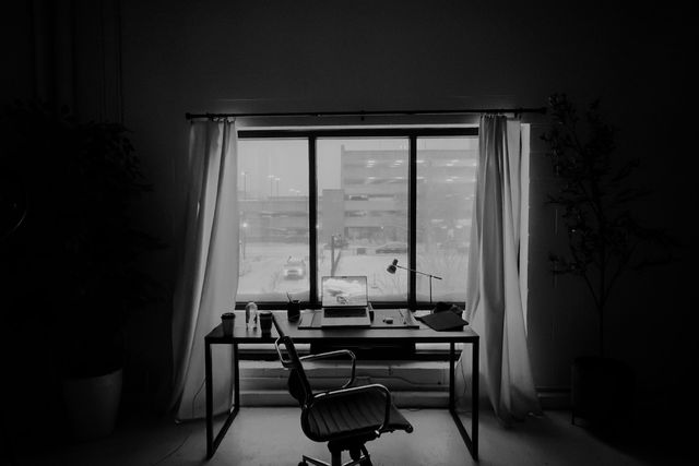 Quiet office desk in front of a window